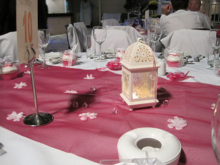 pink table runner with white lantern